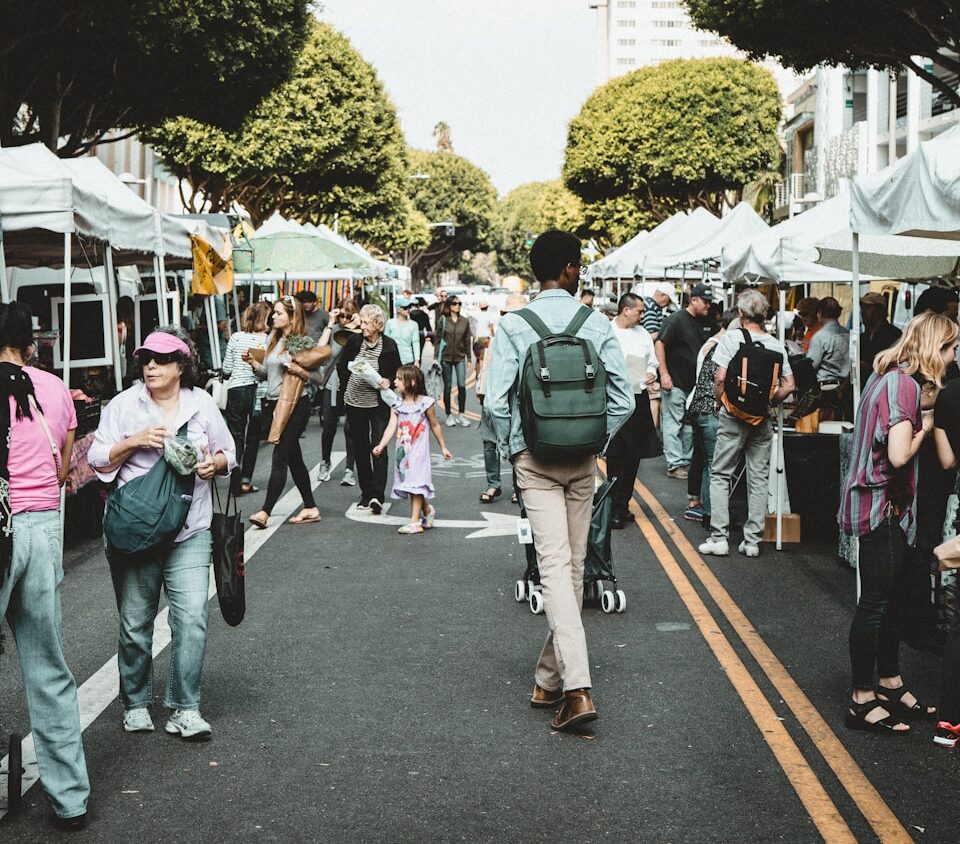 people walking on walkway during daytime